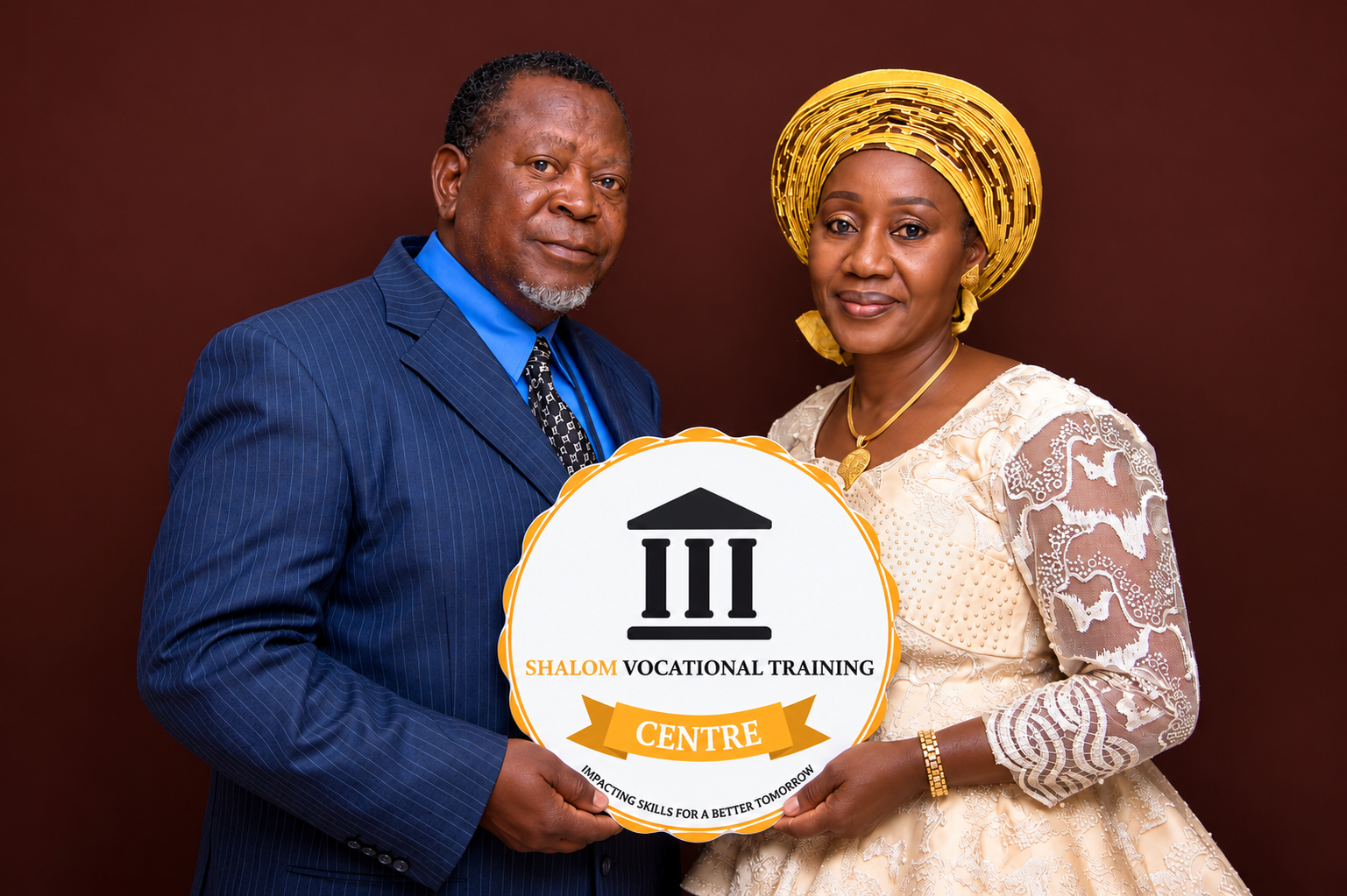 Shalom Vocational Training Centre founders holding the Shalom emblem